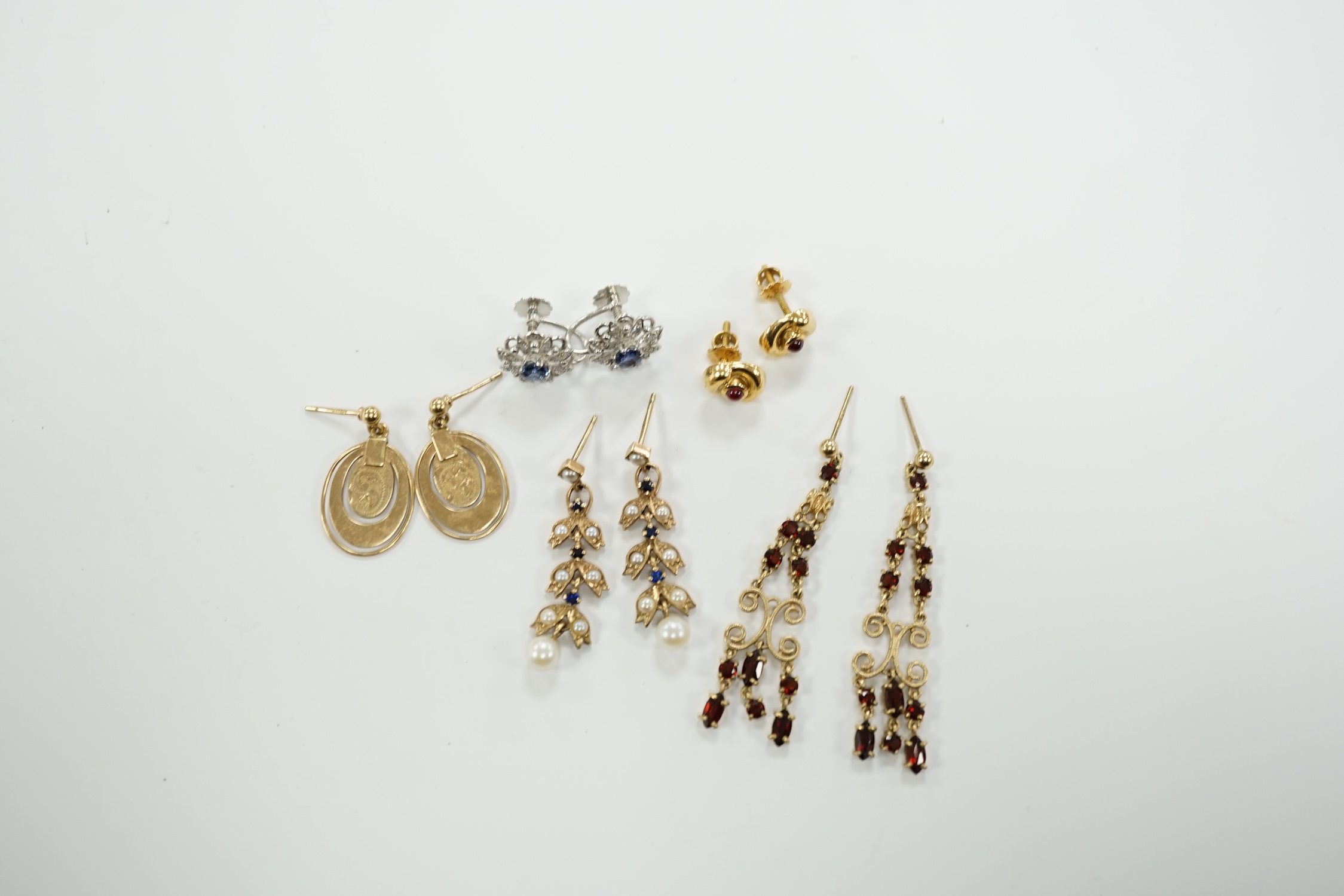 Three pairs of assorted 9ct gold earrings including two gem set, a pair of white metal (stamped 18) and gem set ear clips and a pair of 18k and cabochon ruby ear studs.